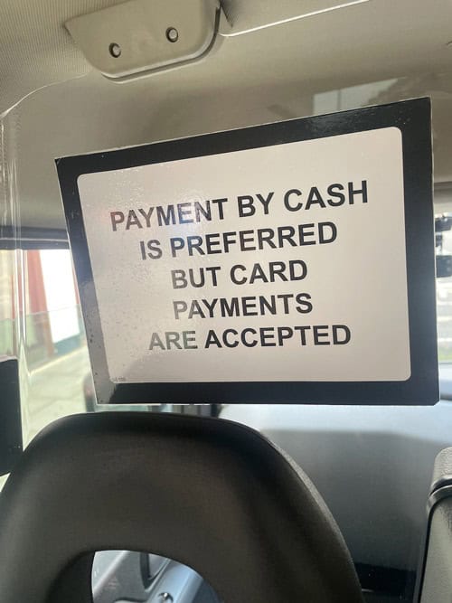 Such signs have sprung up in black cabs across London